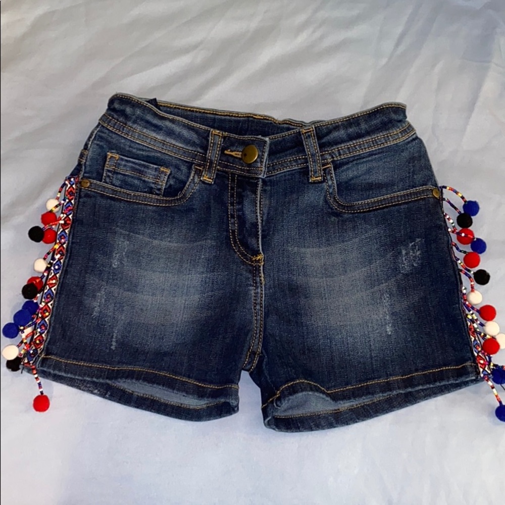 Denim shorts with designs on the side